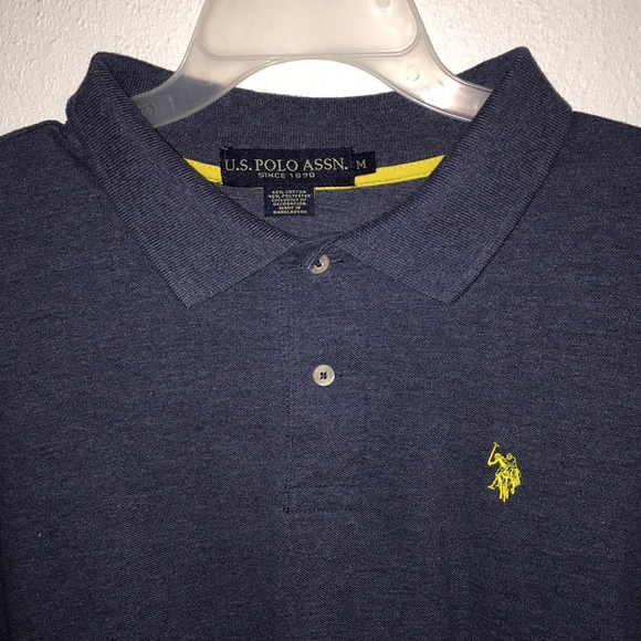 Navy blue polo tee with neon yellow logo. - Picture 2 of 3